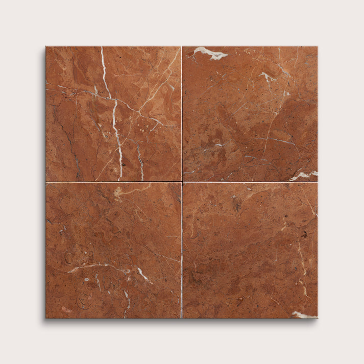 Four brown marble tiles arranged in a grid pattern on a white background