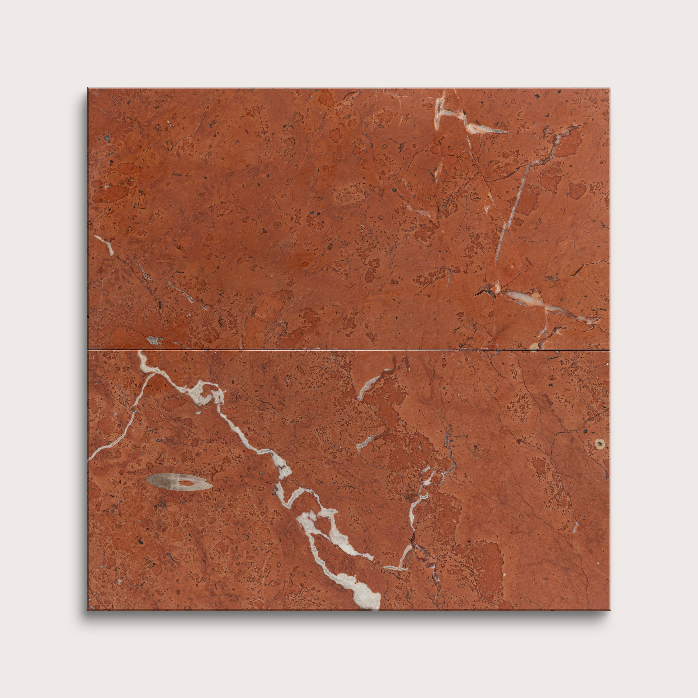 Brown marble tile with white veins on a light gray background