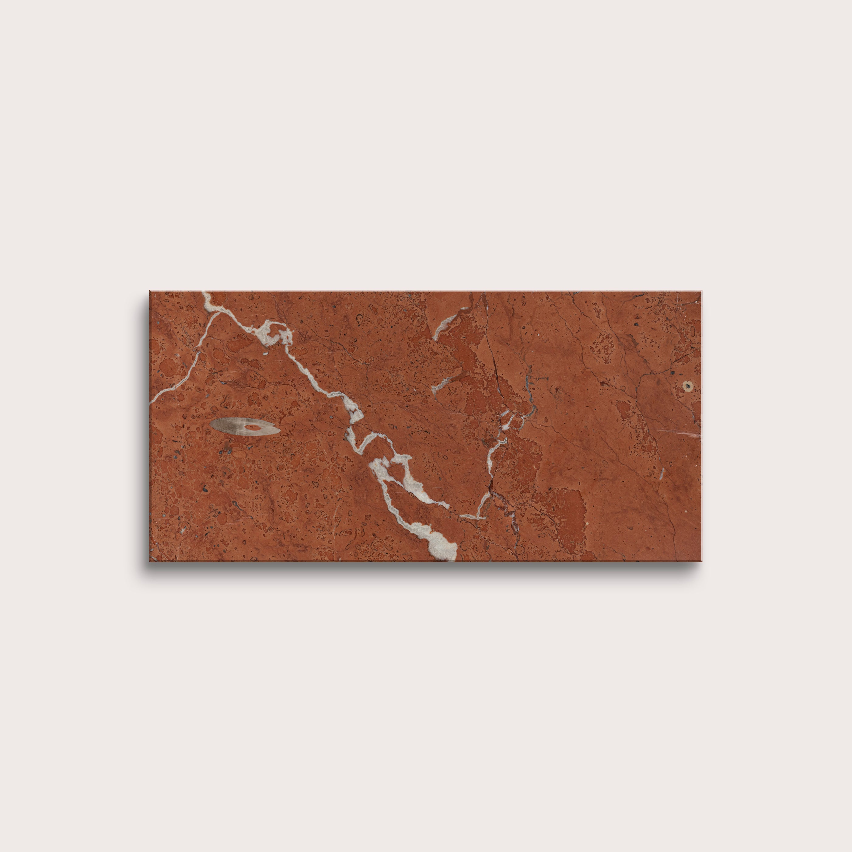 Rectangular tile with a brown and white marbled pattern on a light gray background
