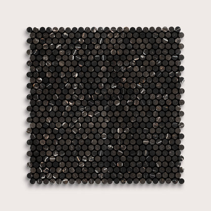 Square marble tile with black circular pattern on a light gray background