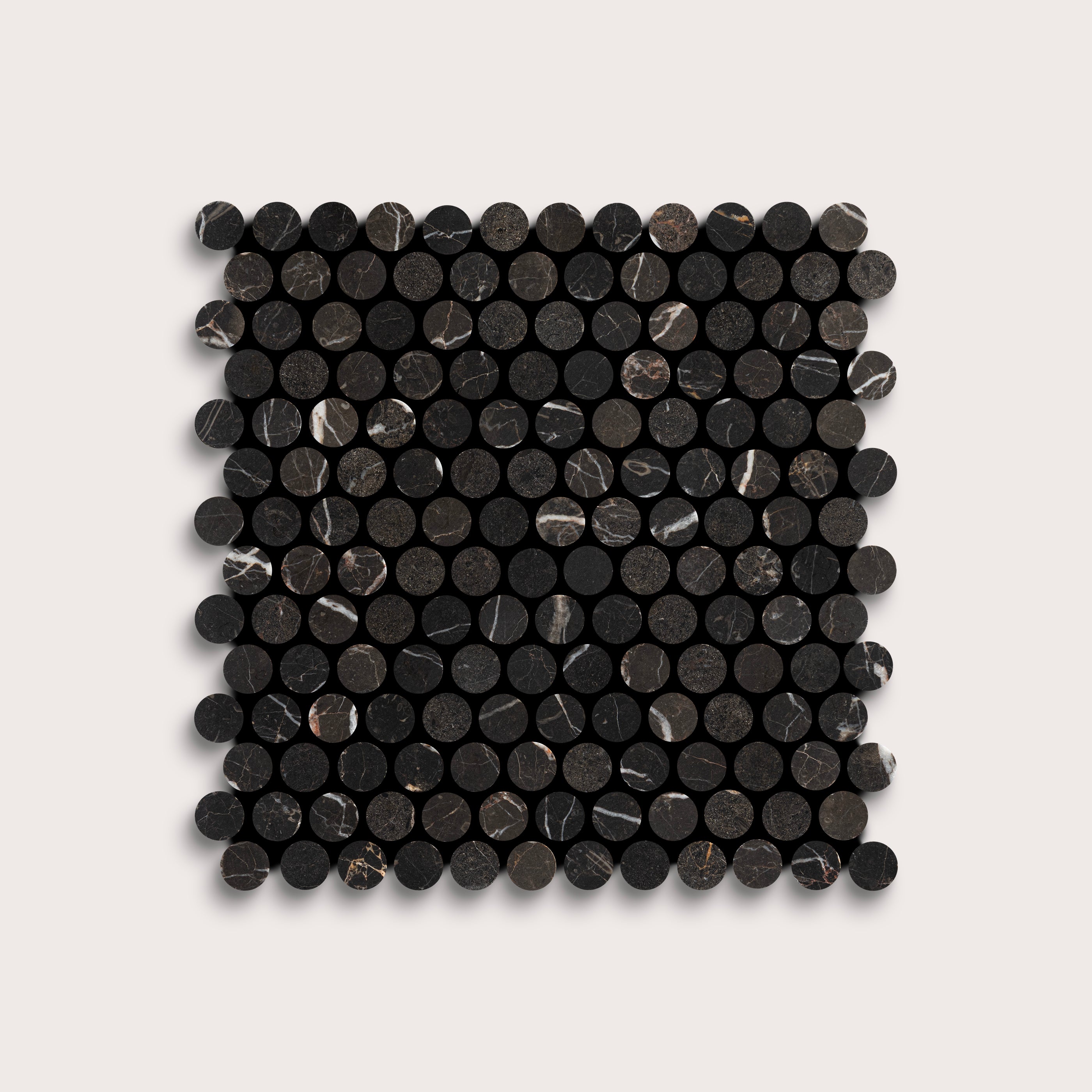 Square arrangement of black circular marble tiles on a light gray background