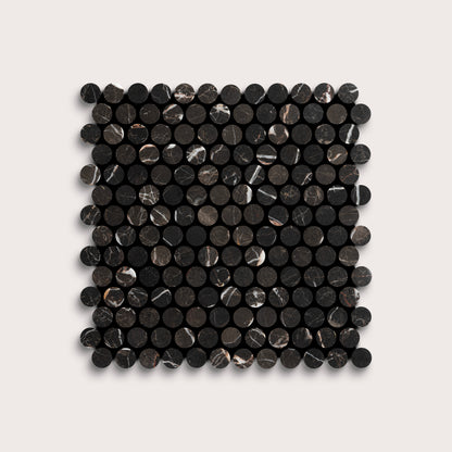 Square arrangement of black circular marble tiles on a light gray background