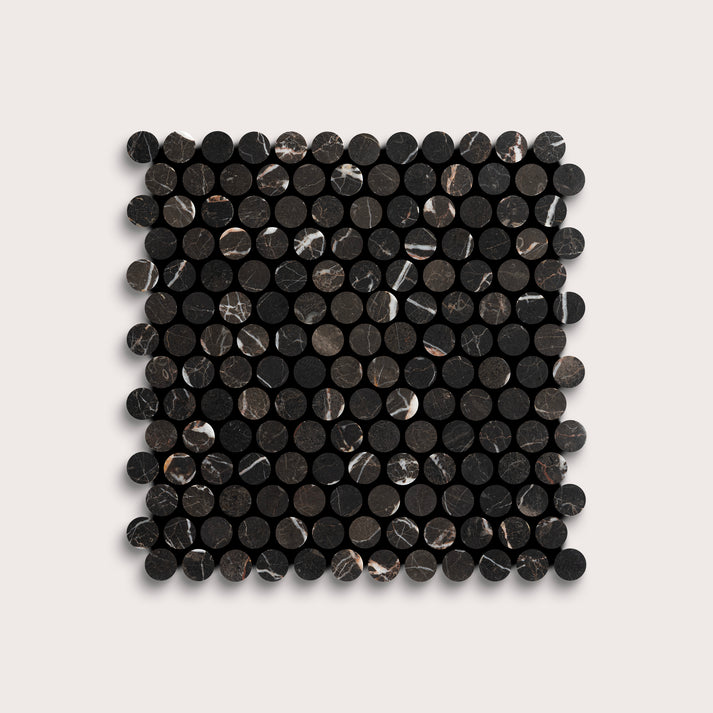 Square arrangement of black circular marble tiles on a light gray background