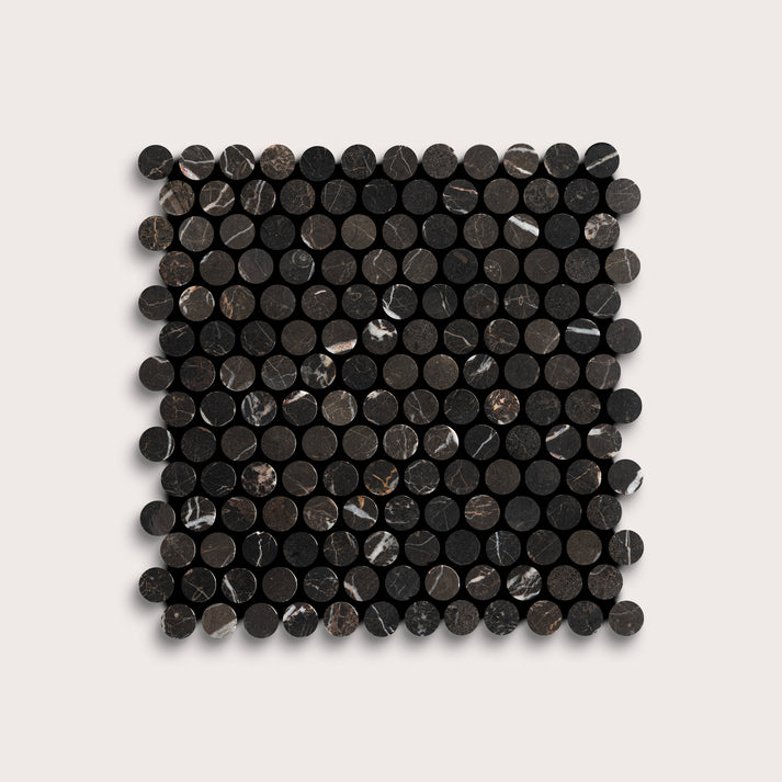 Square arrangement of black circular marble tiles on a light gray background