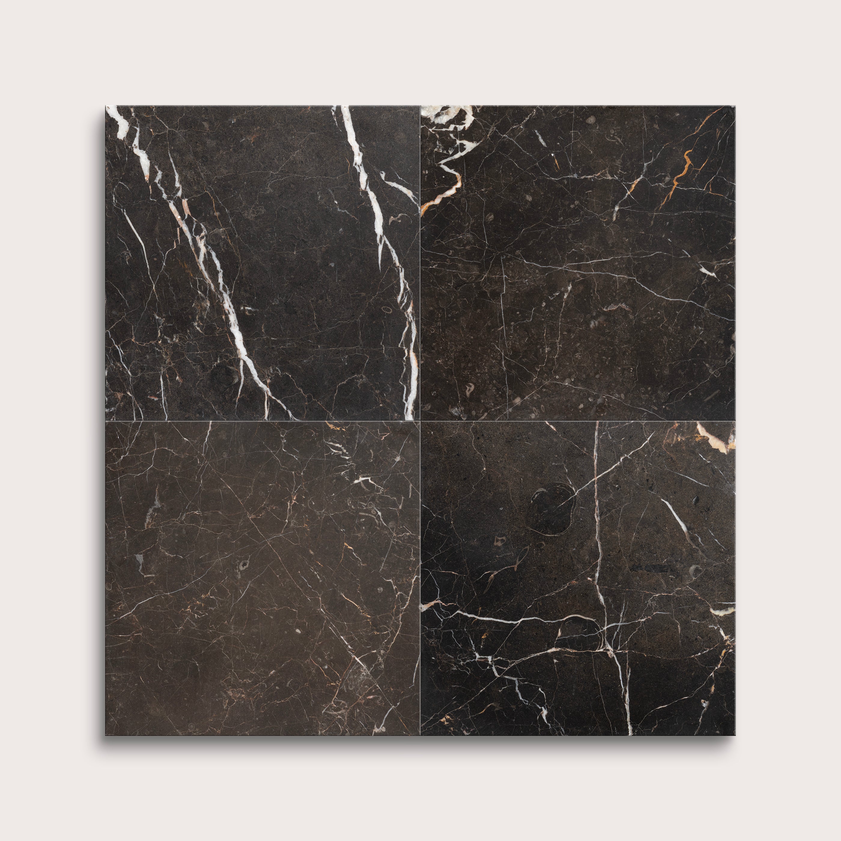 brown marble tiles with visible veins on a white background