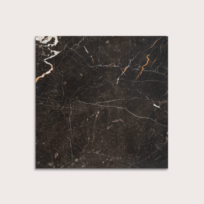 brown marble tiles with visible veins on a white background