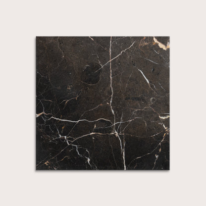 brown marble tiles with visible veins on a white background