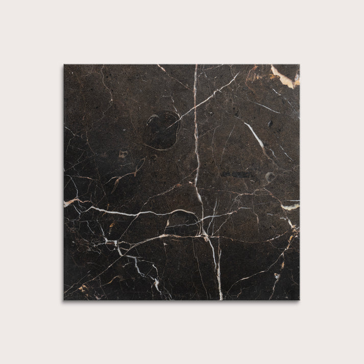 brown marble tiles with visible veins on a white background