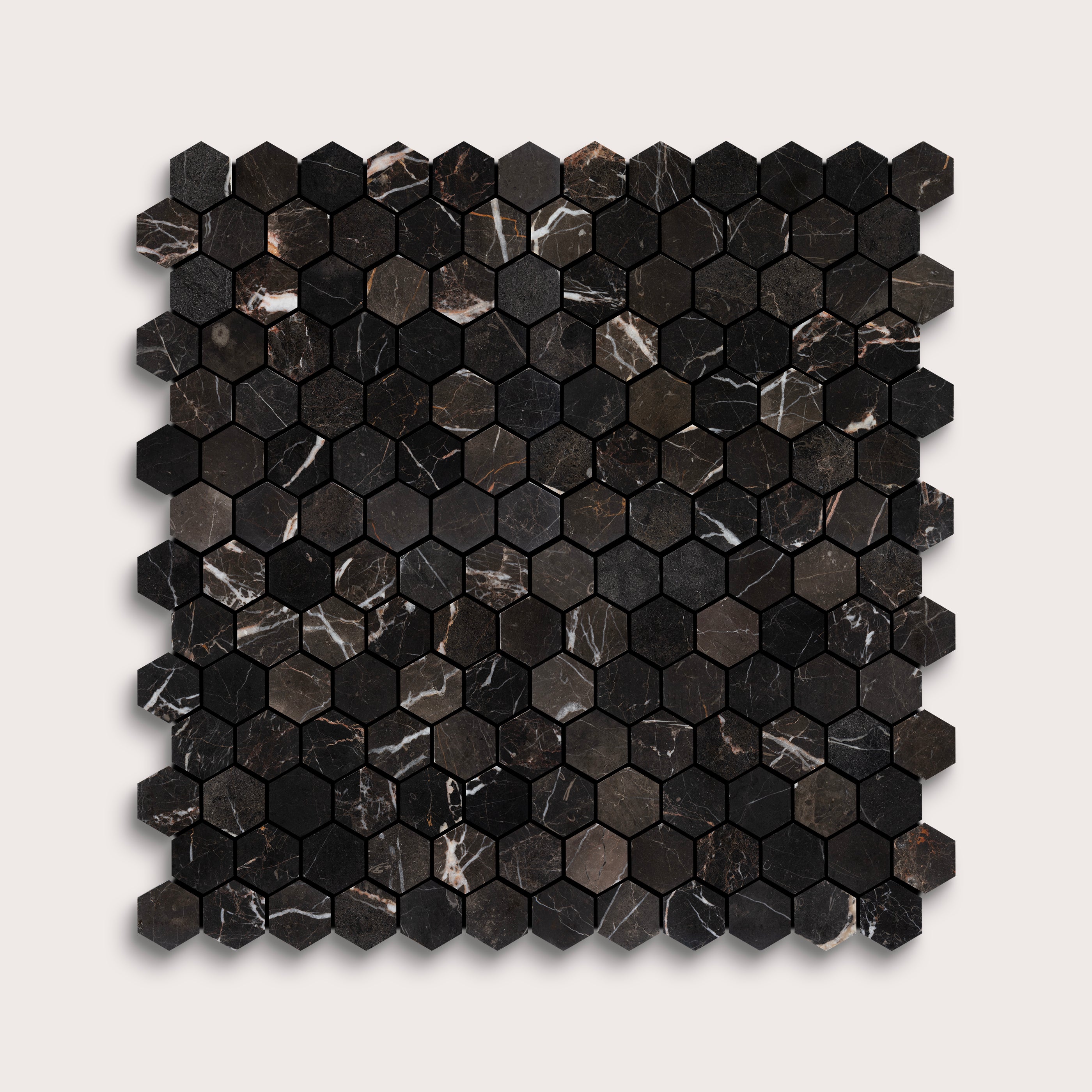 Hexagonal black marble mosaic tile on a white background