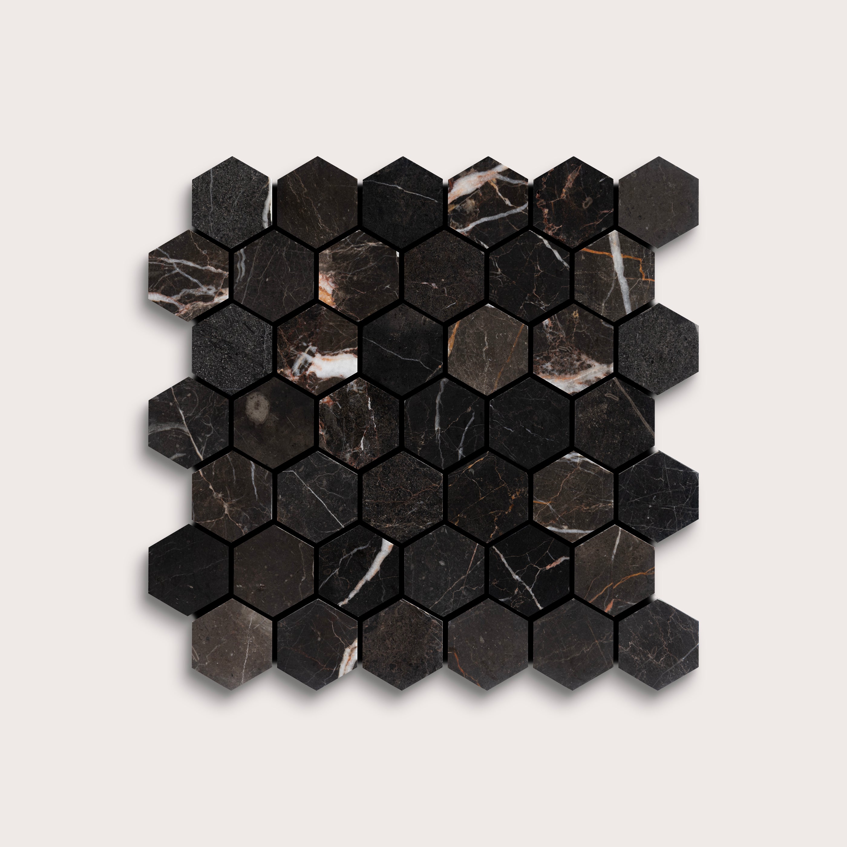 Hexagonal black marble mosaic tile on a light gray background