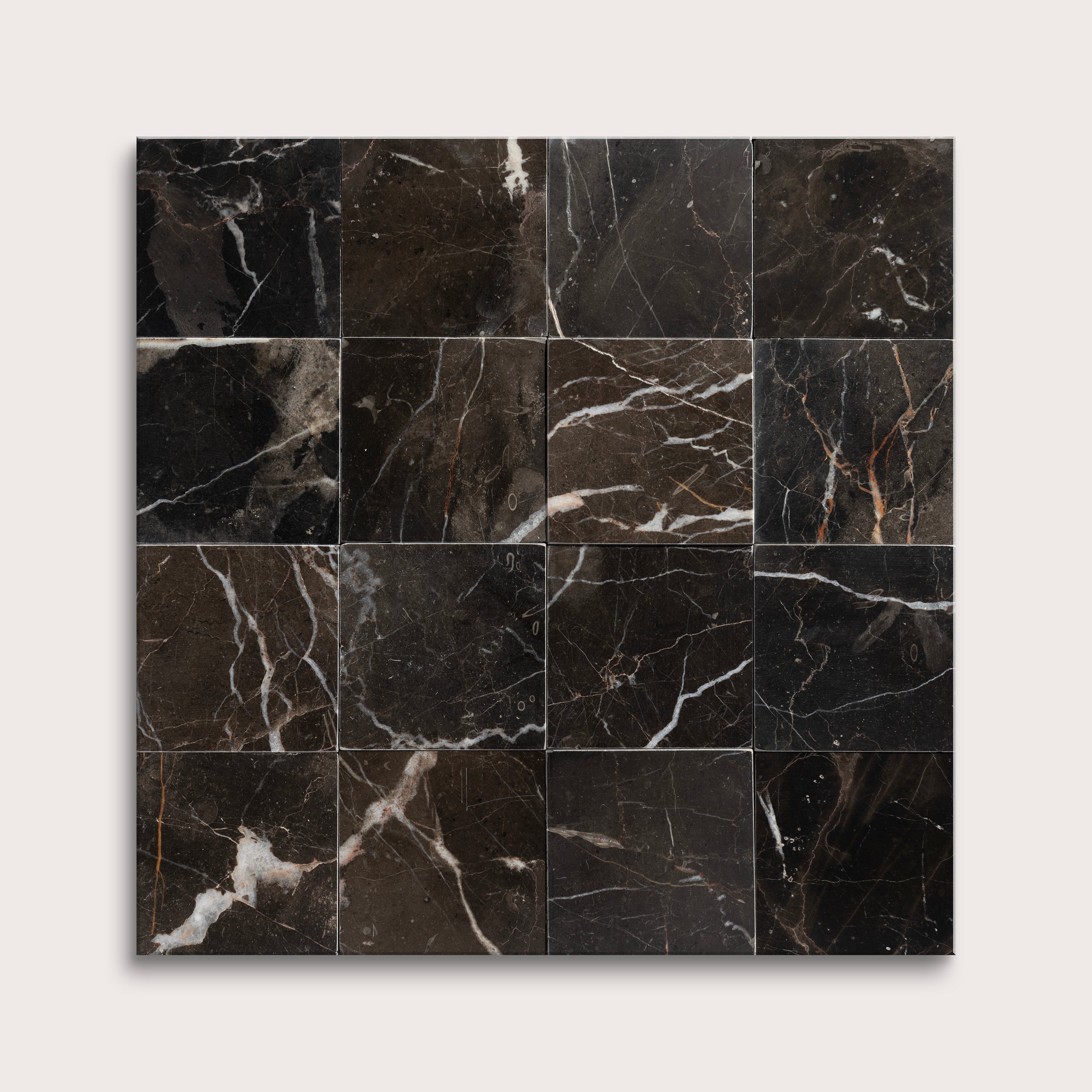 Black marble tiles arranged in a grid pattern on a white background