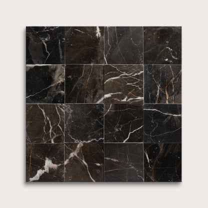 Black marble tiles arranged in a grid pattern on a white background