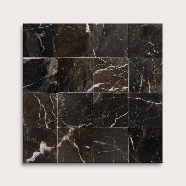 Black marble tiles arranged in a grid pattern on a white background
