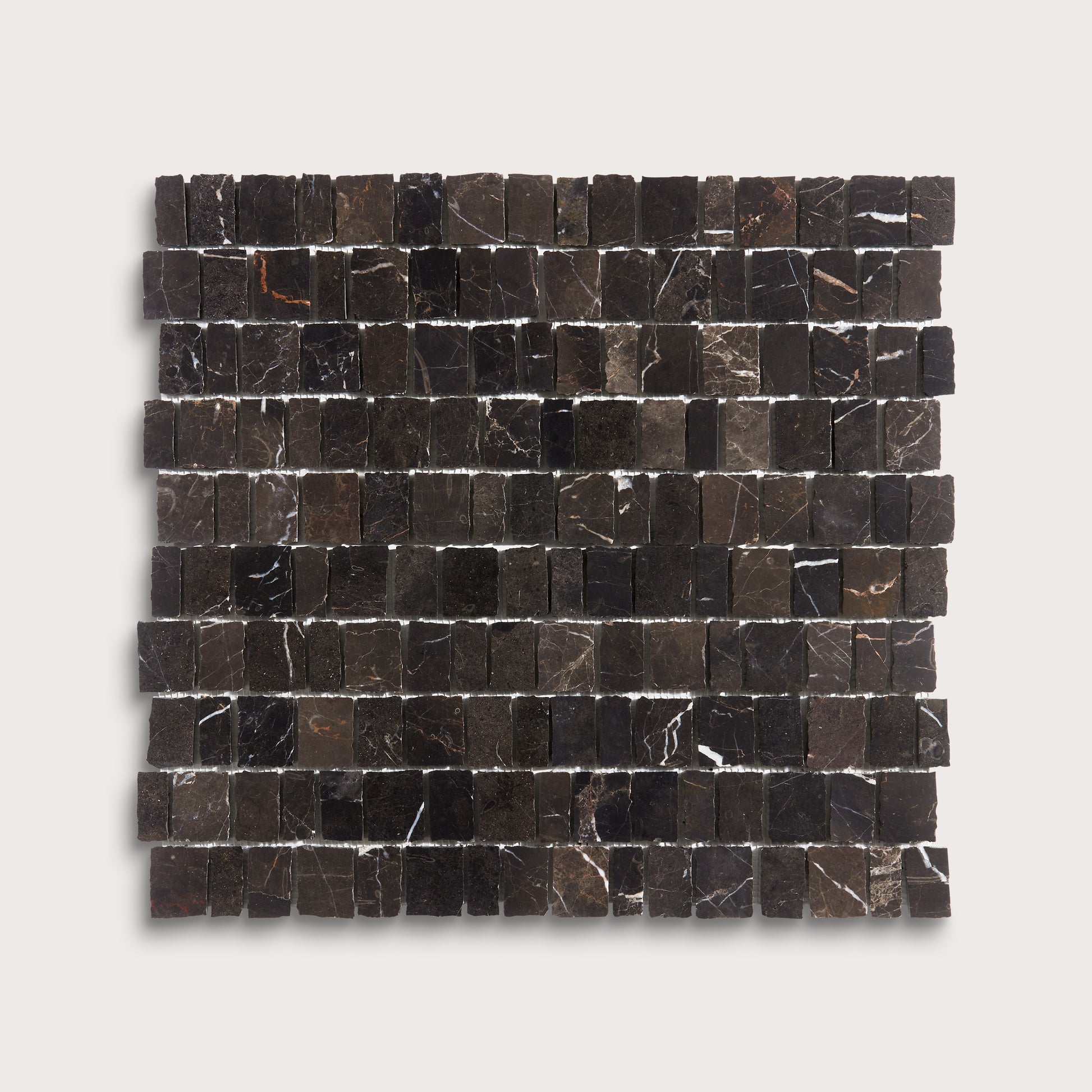A square sample of dark marble mosaic tiles with natural white and brown veining, arranged in a grid pattern against a light gray background.