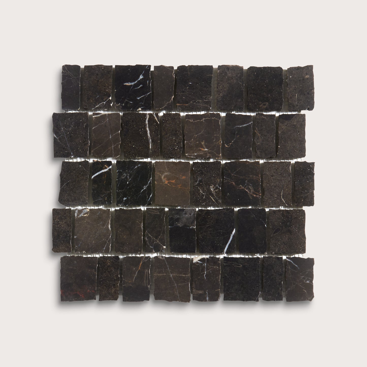 A square arrangement of small dark stone tiles with natural veining, displayed on a light gray background.