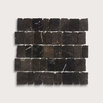 A square arrangement of small dark stone tiles with natural veining, displayed on a light gray background.