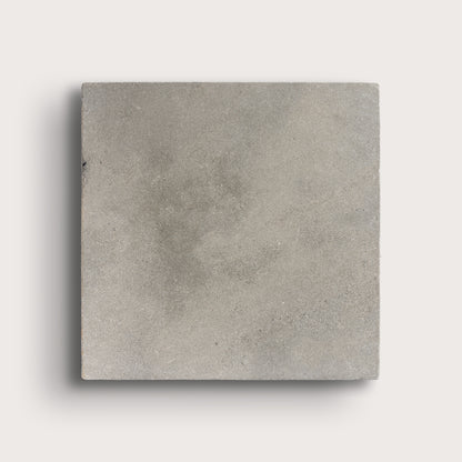 grey square limestone tiles on a light grey background