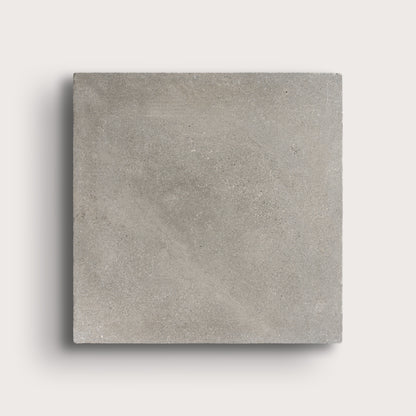 grey square limestone tiles on a light grey background