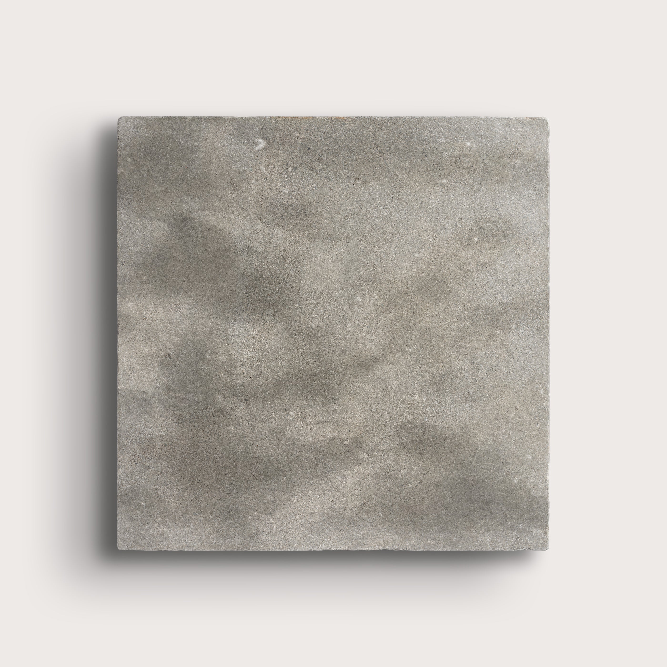 grey square limestone tiles on a light grey background