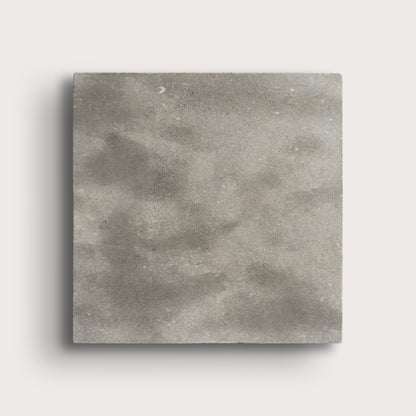 grey square limestone tiles on a light grey background