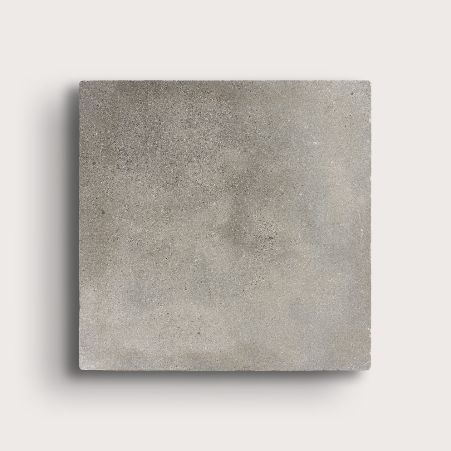 grey square limestone tiles on a light grey background