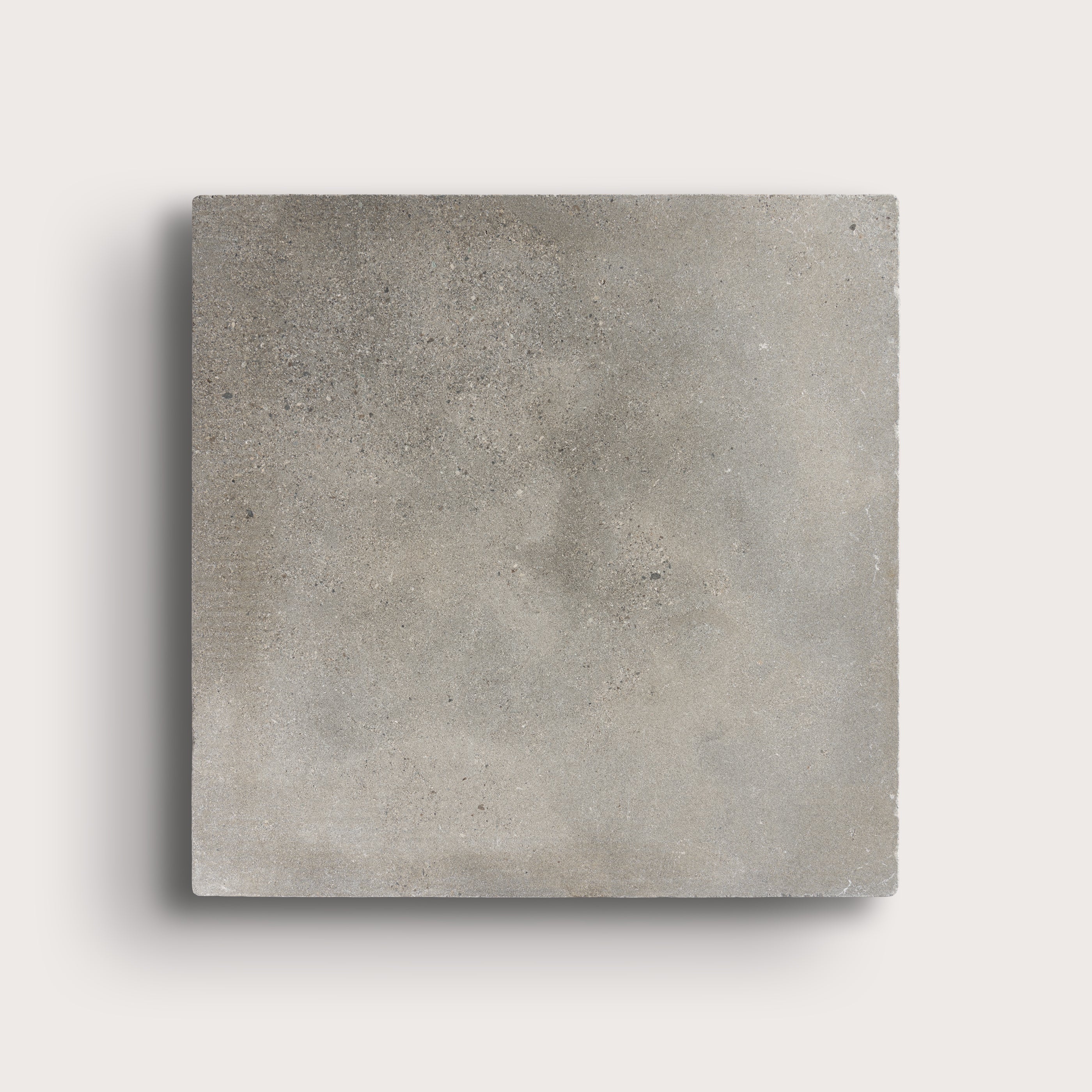 grey square limestone tiles on a light grey background