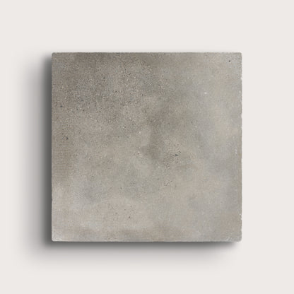 grey square limestone tiles on a light grey background