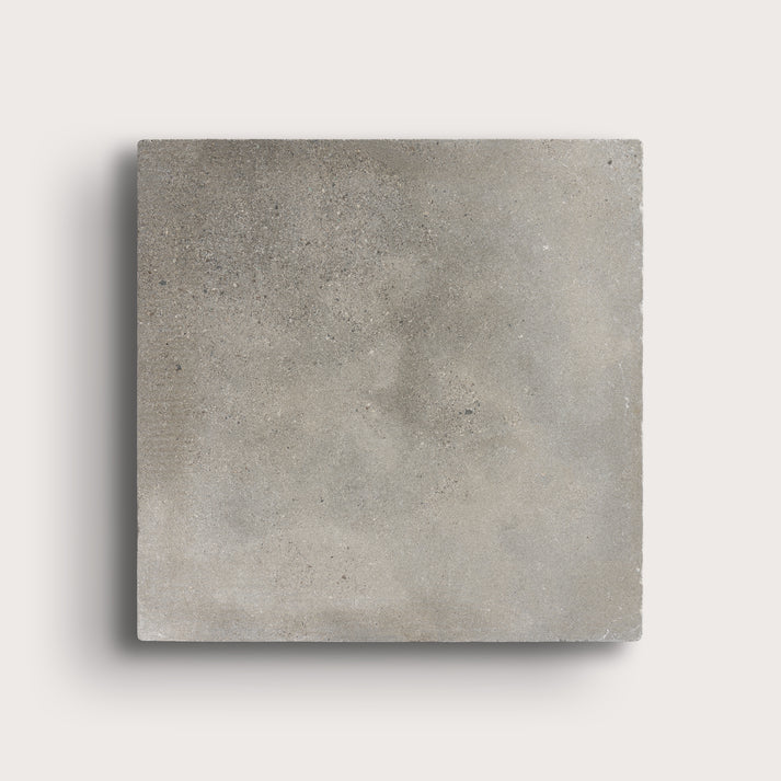 grey square limestone tiles on a light grey background