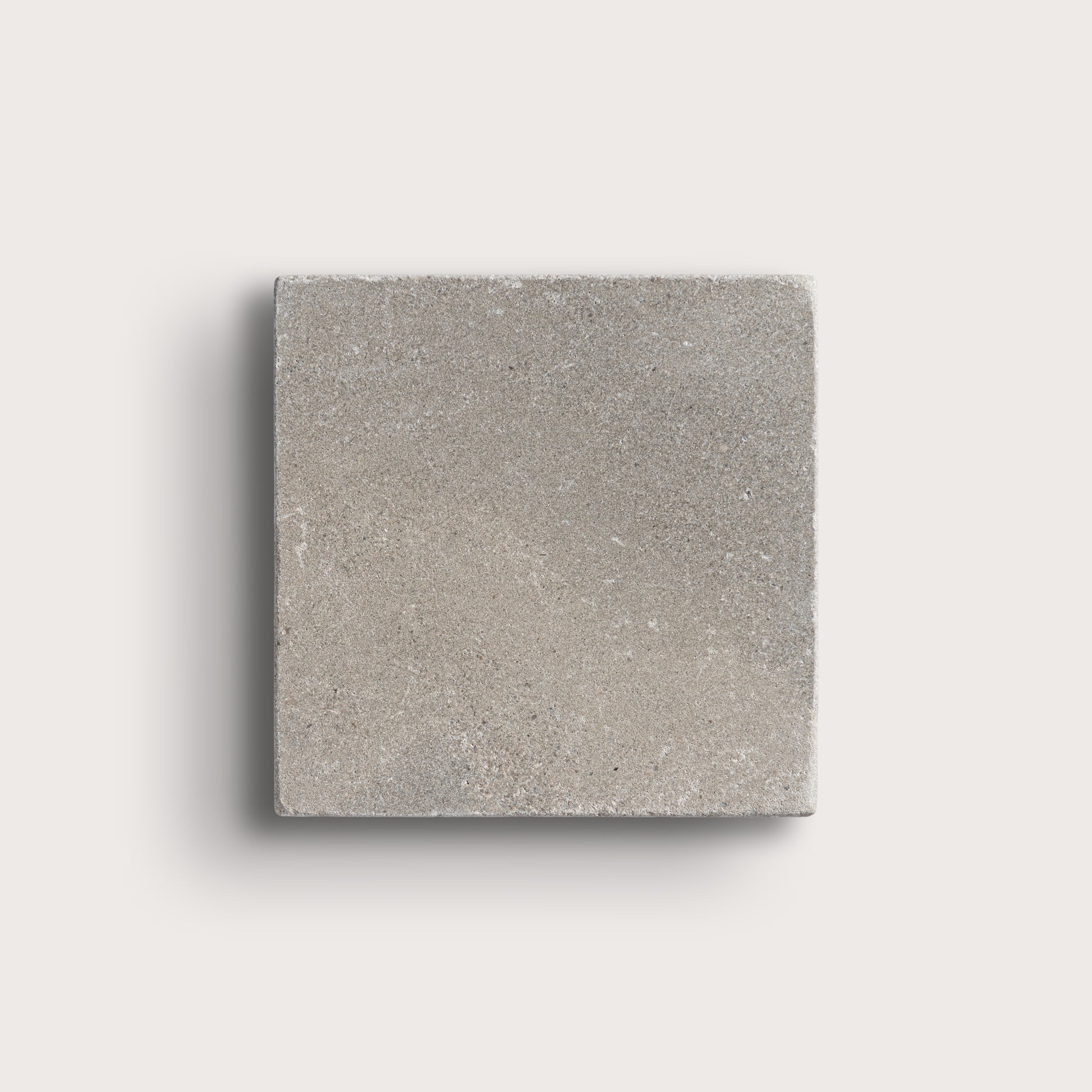 grey limestone square tile on light grey background