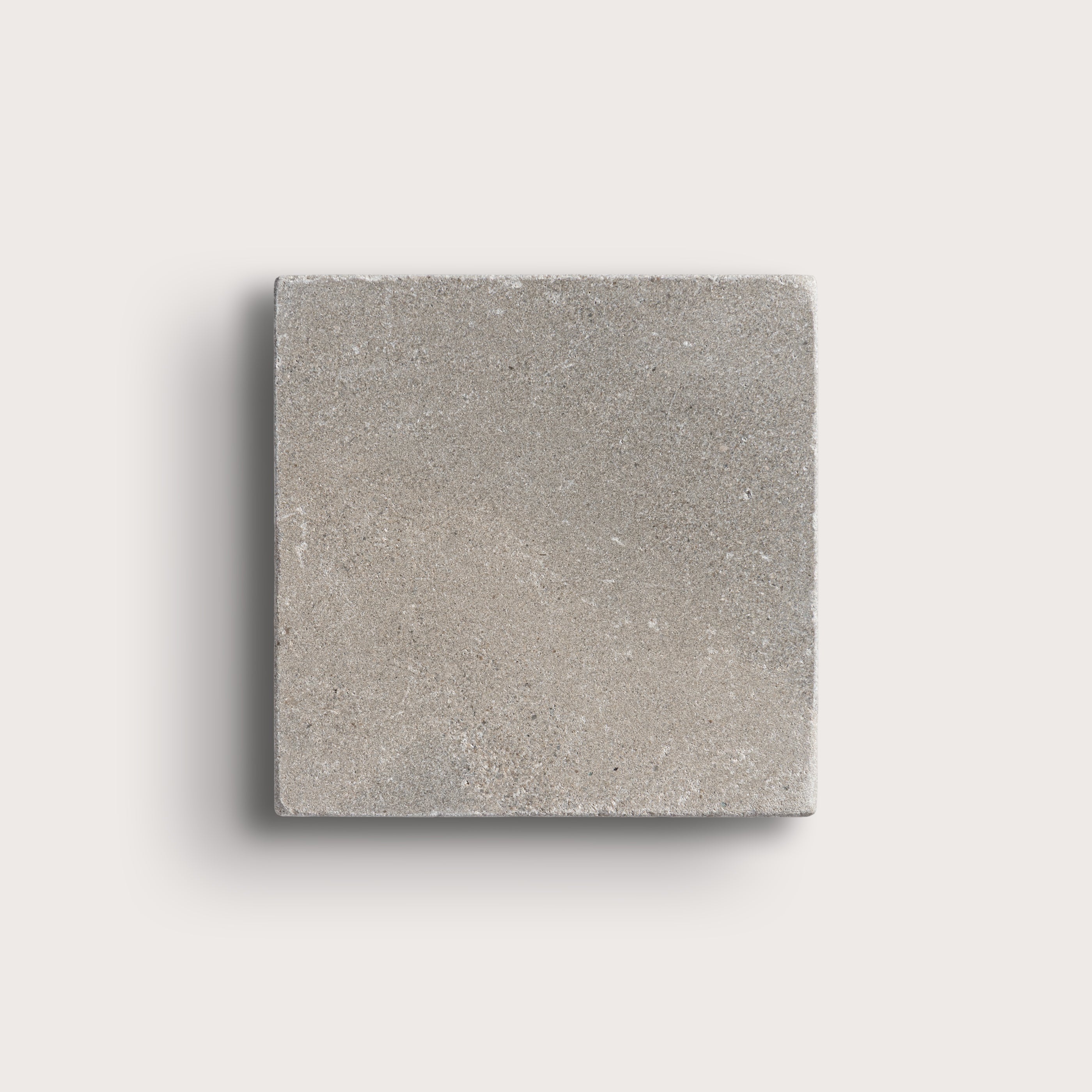 grey limestone square tile on light grey background