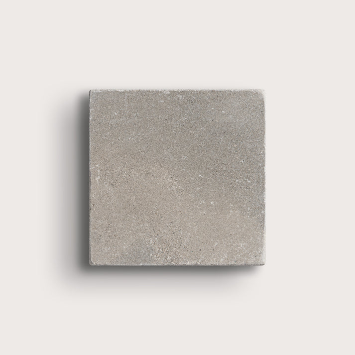 grey limestone square tile on light grey background
