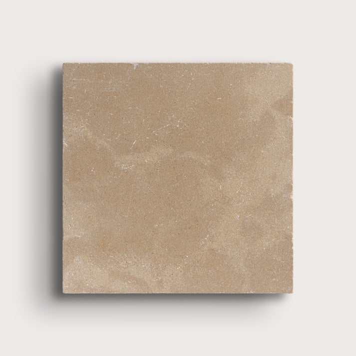 beige limestone square tile on light grey background