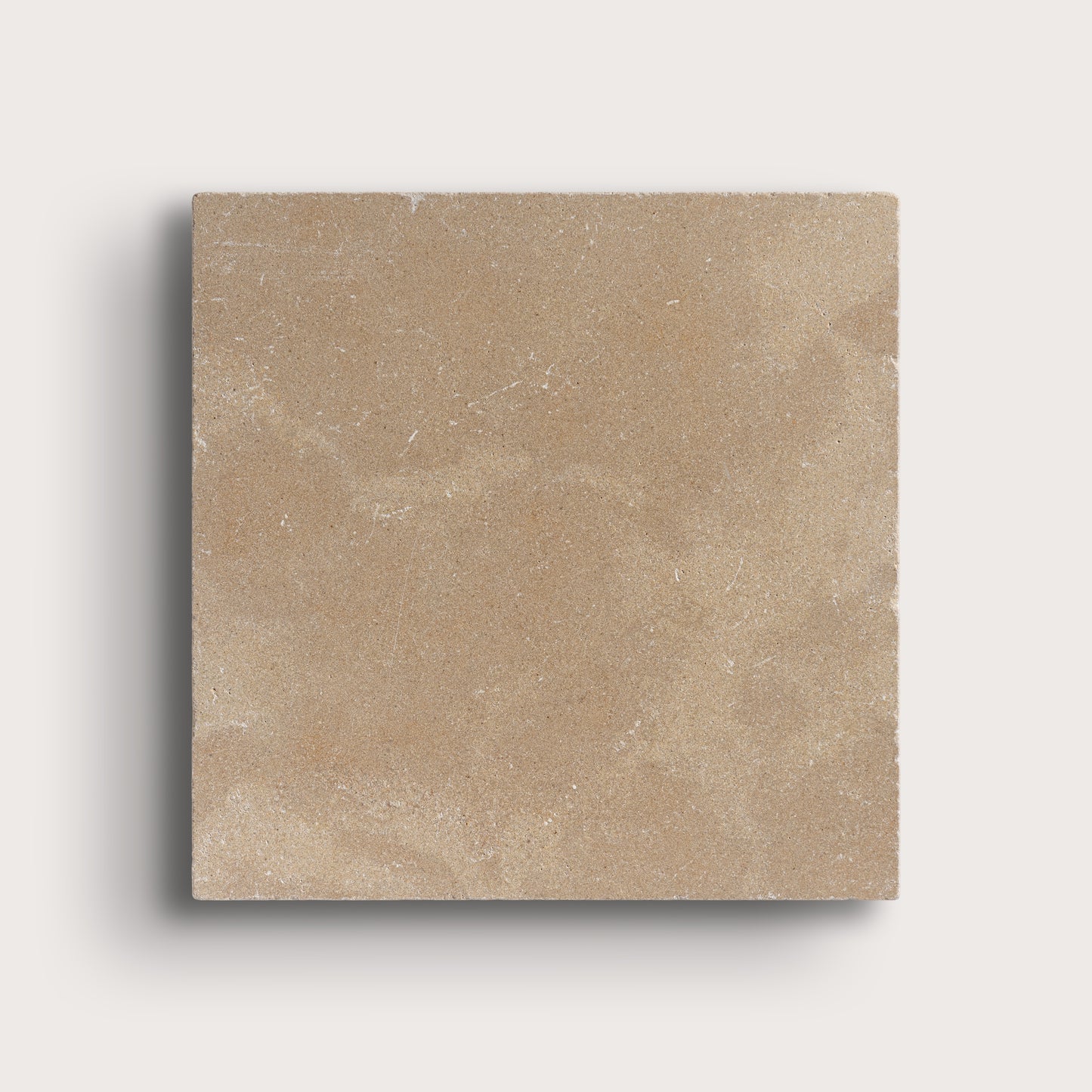 beige limestone tile on light grey background