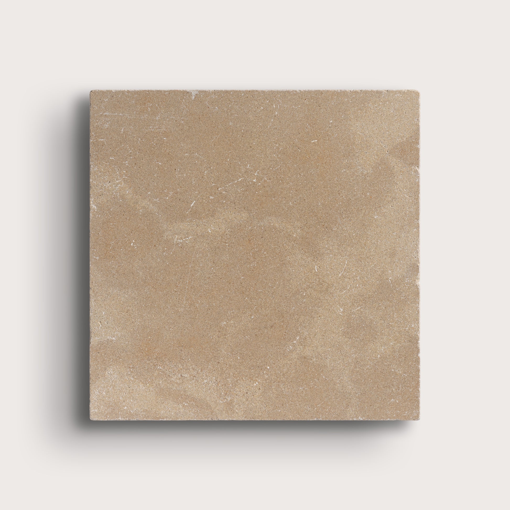 beige limestone tile on light grey background