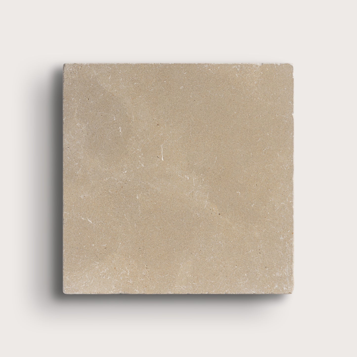 beige limestone square tile on light grey background