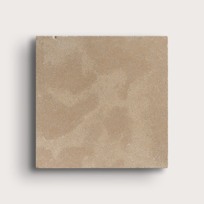 beige limestone square tile on light grey background