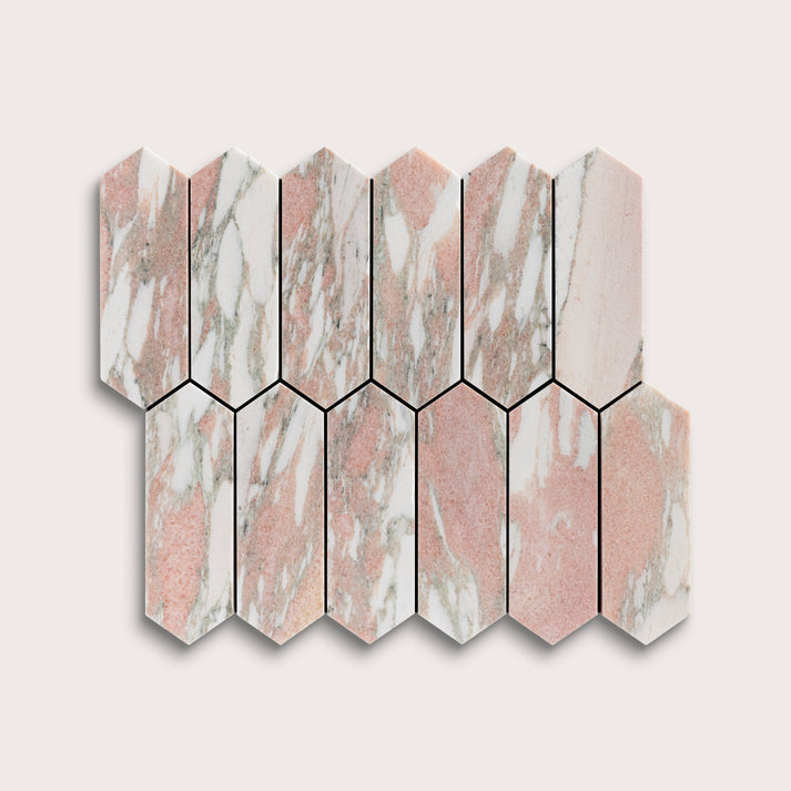 Hexagonal marble tiles with a pink and white pattern on a light gray background