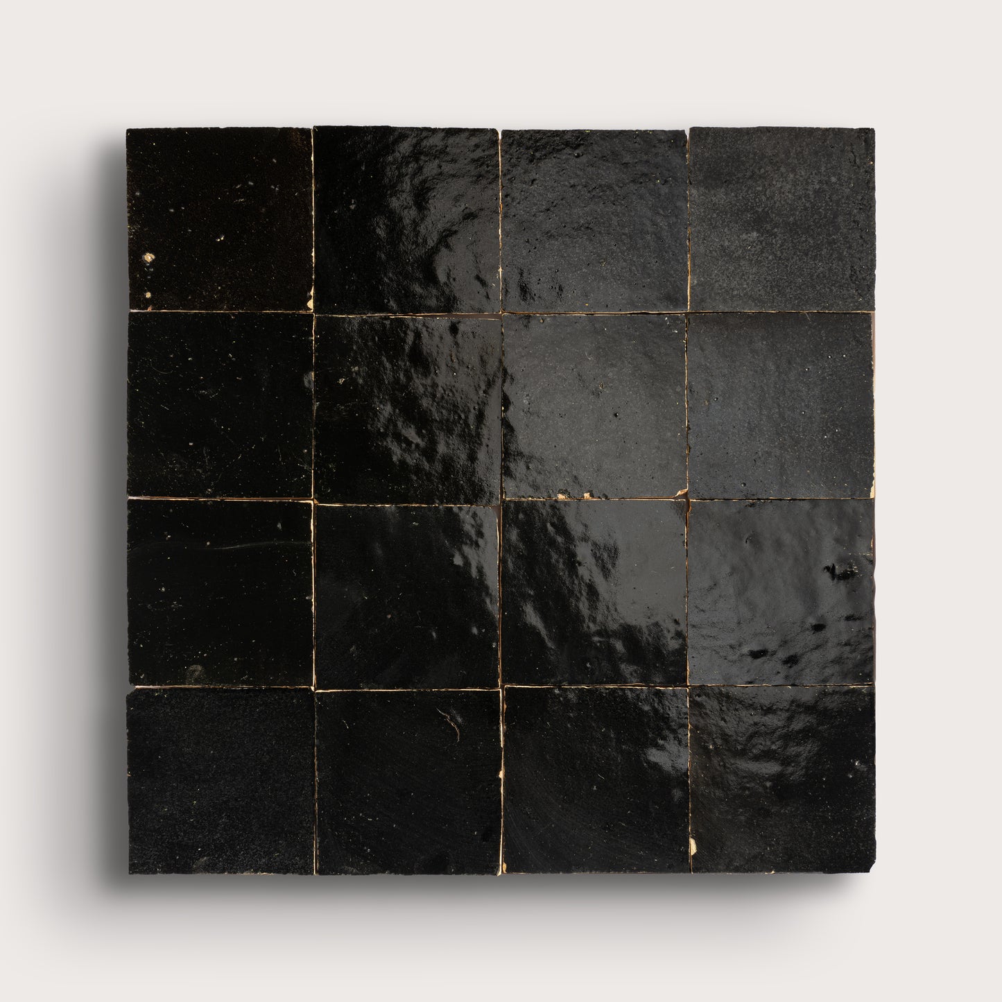 Black square zellige tiles on a white background