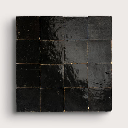 Black square zellige tiles on a white background