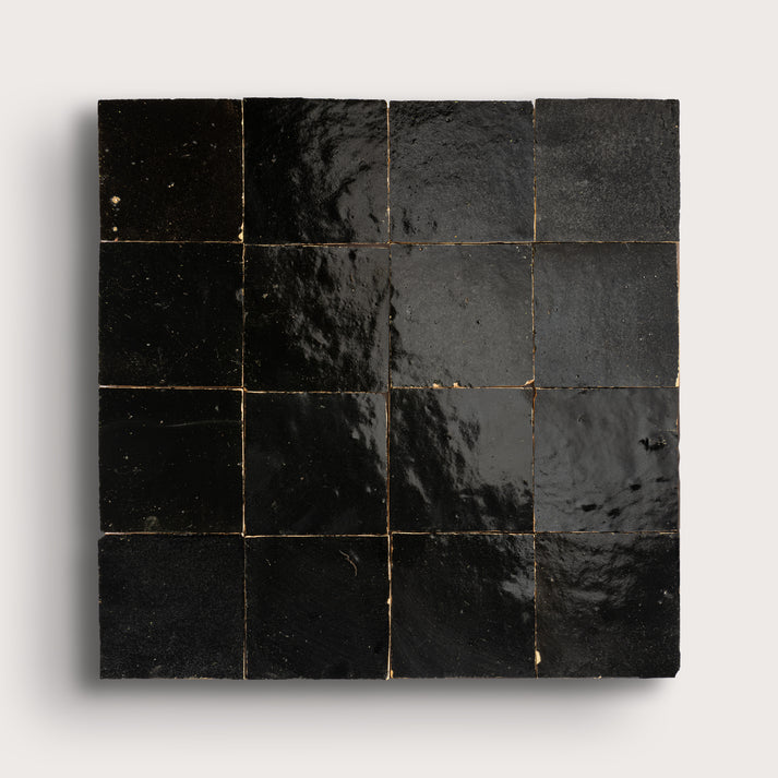 Black square zellige tiles on a white background