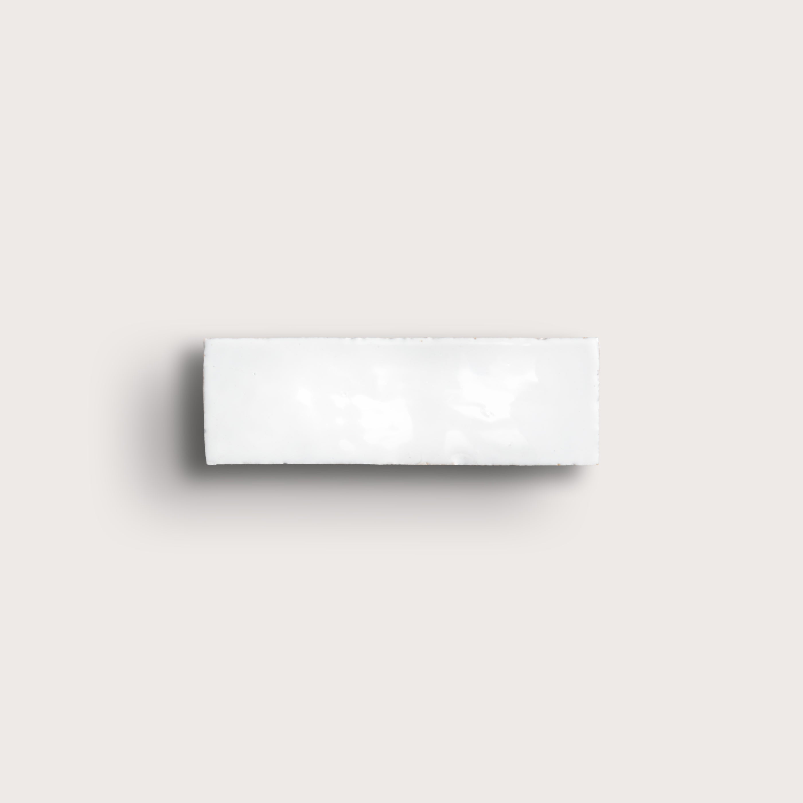 White rectangular zellige tile on a light gray background