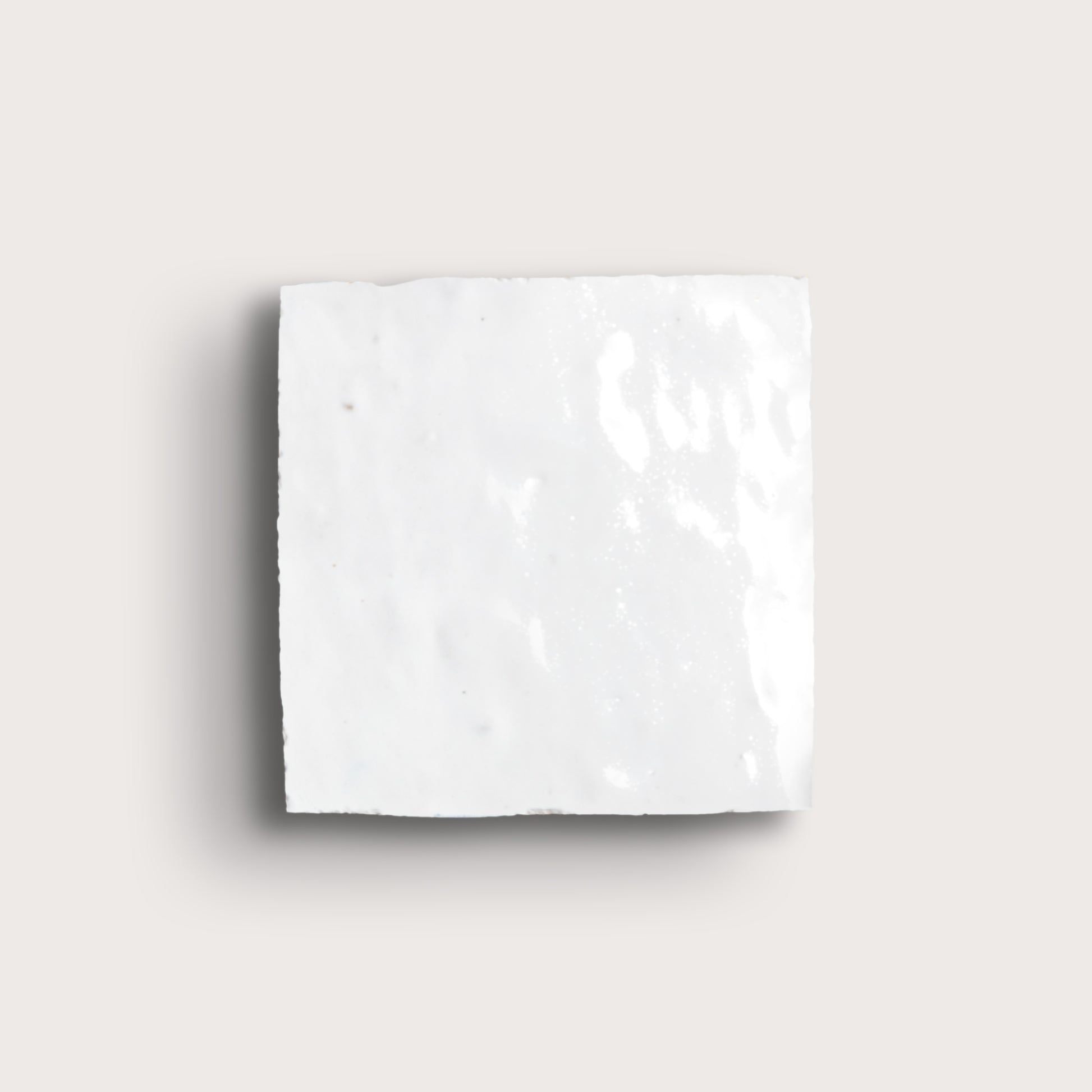 white zellige tile on a light grey background