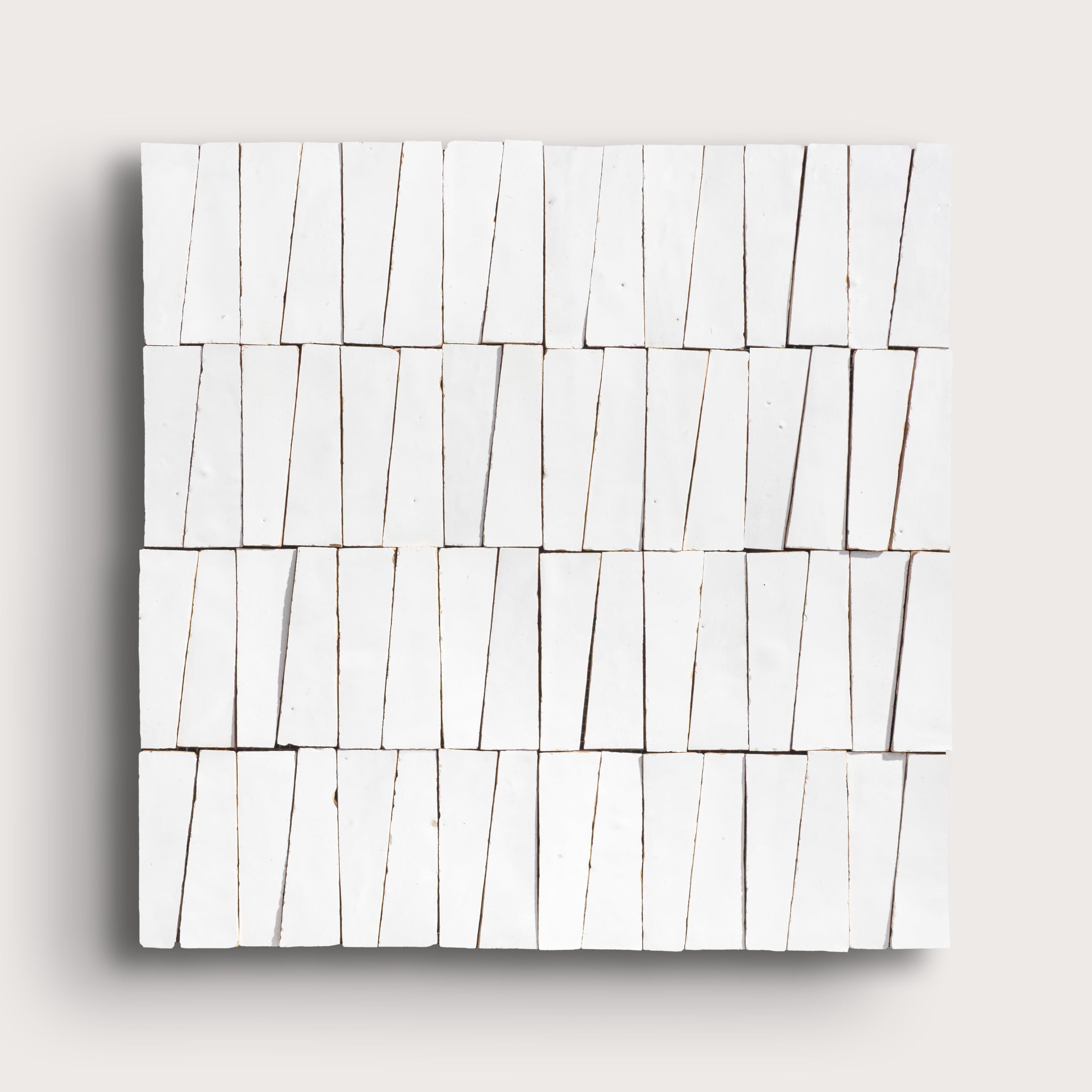 white zellige trapezoid design on a light gray background