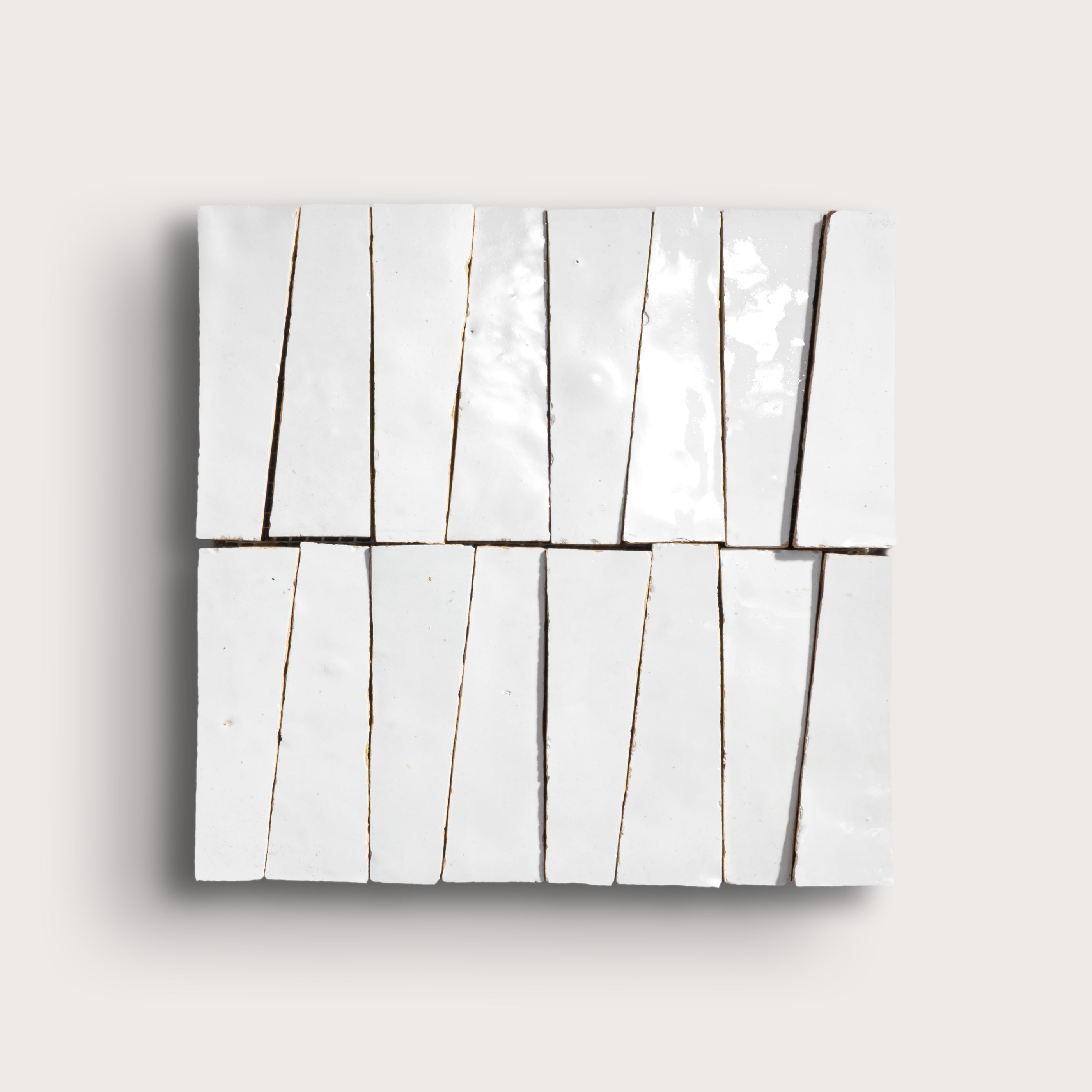 white zellige trapezoid design on a light gray background