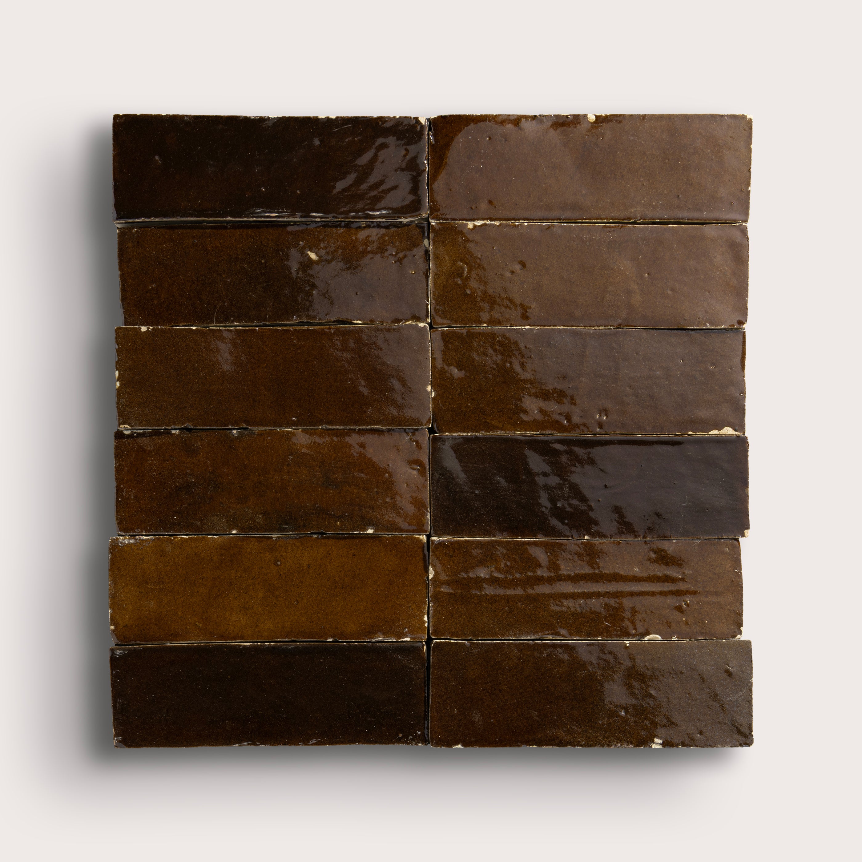 brown rectangle zellige tile in a grid pattern on a light grey background