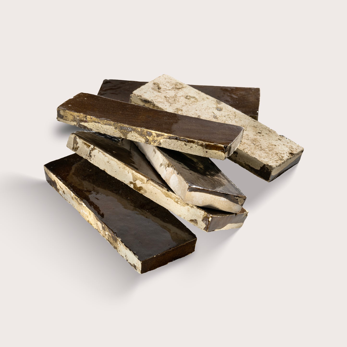 rectangle brown zellige tile stacked on a light grey background