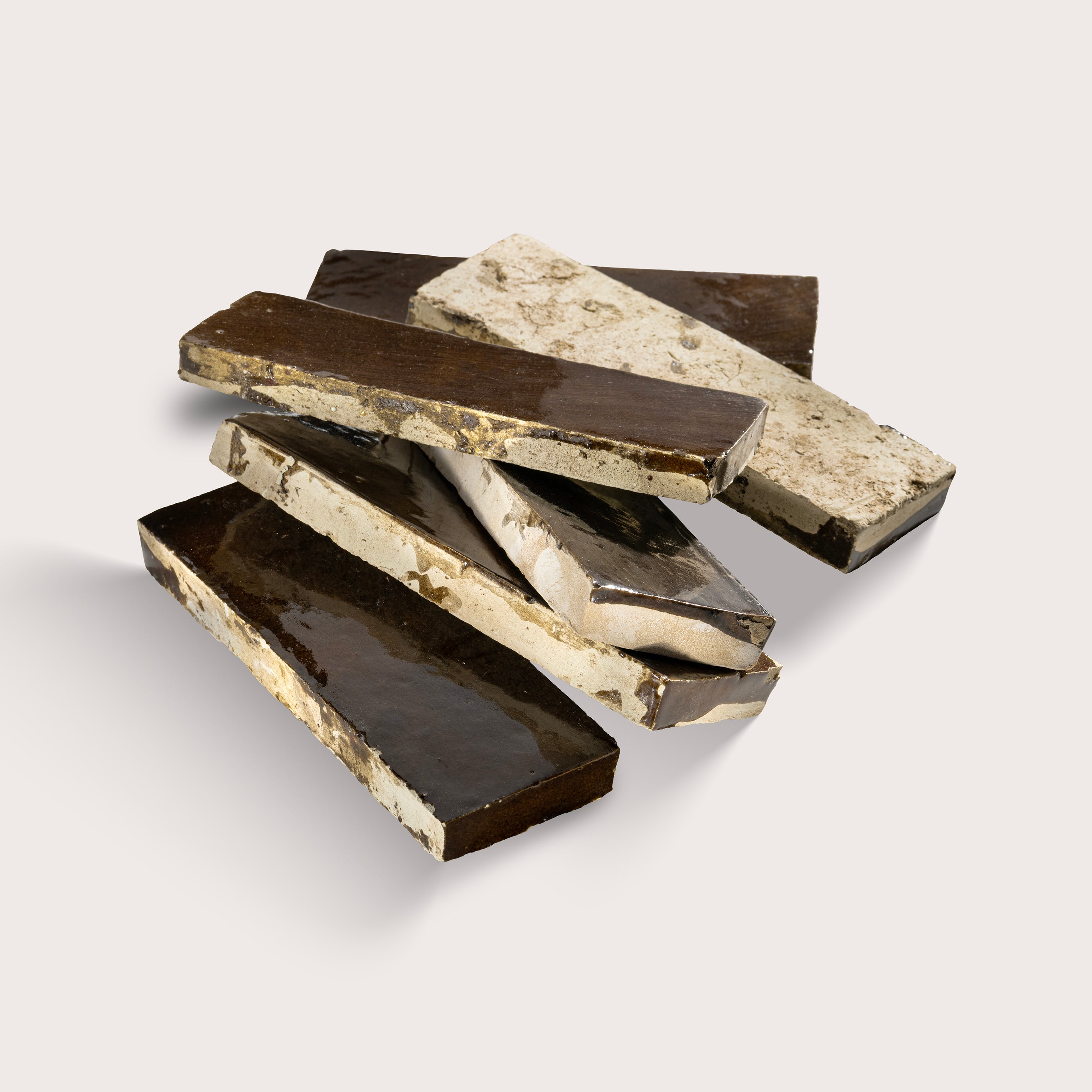 rectangle brown zellige tile stacked on a light grey background