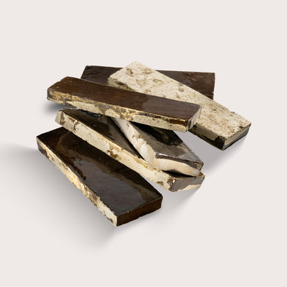rectangle brown zellige tile stacked on a light grey background