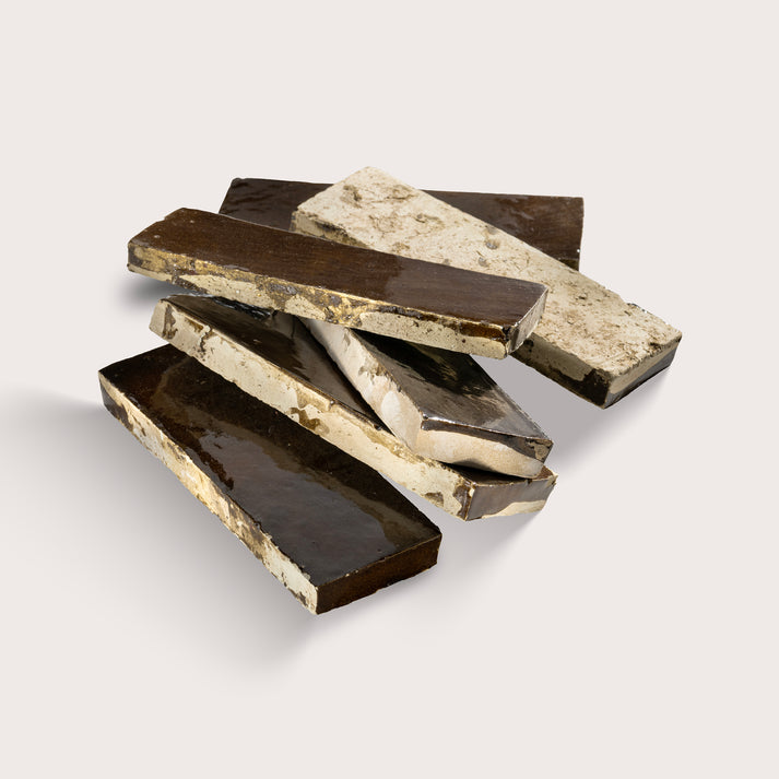 rectangle brown zellige tile stacked on a light grey background