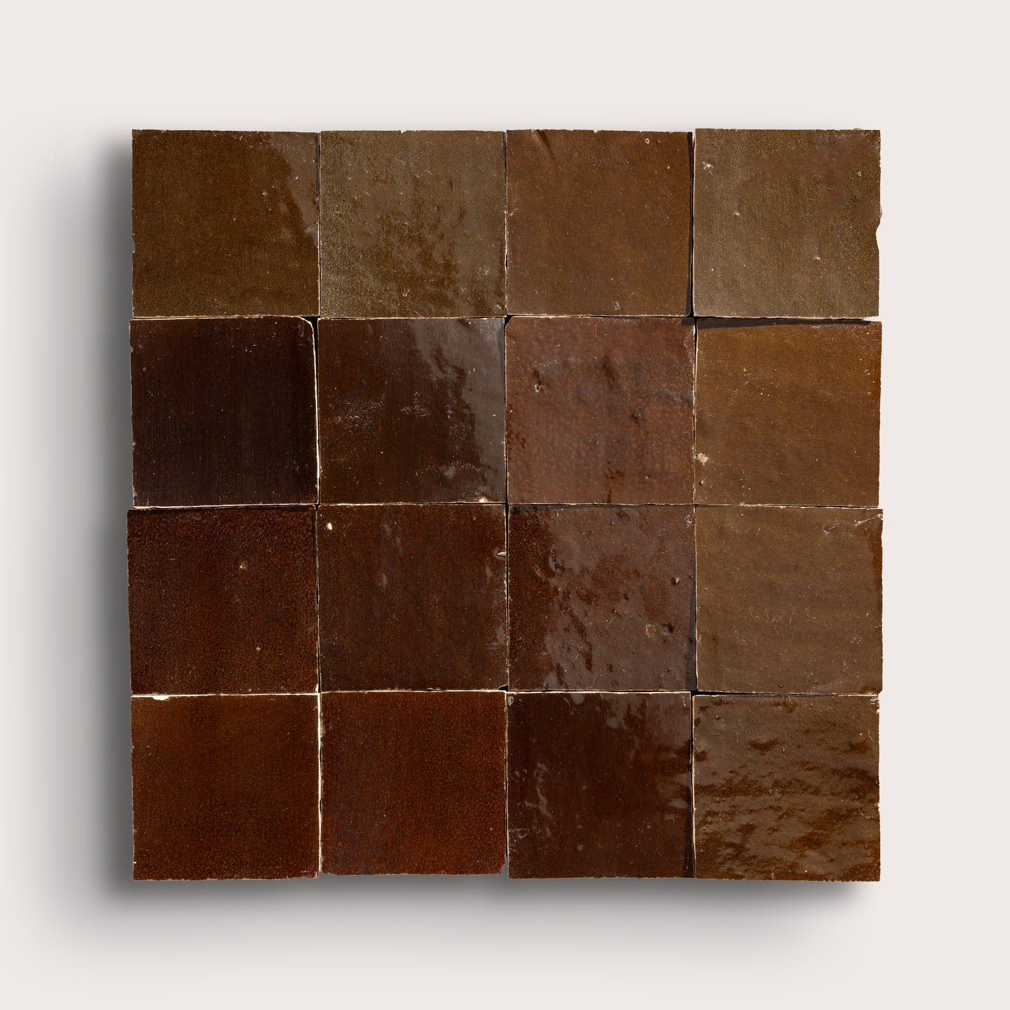 brown square zellige tile in grid pattern on a light grey background